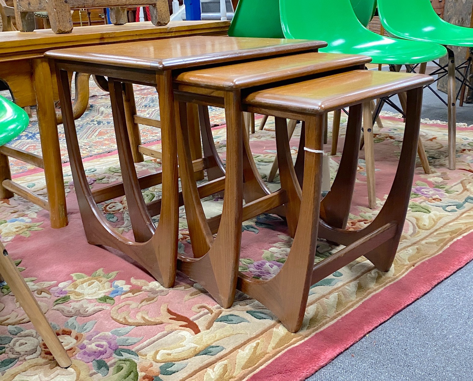 A nest of three teak G Plan tables, width 51cm, depth 49cm, height 50cm